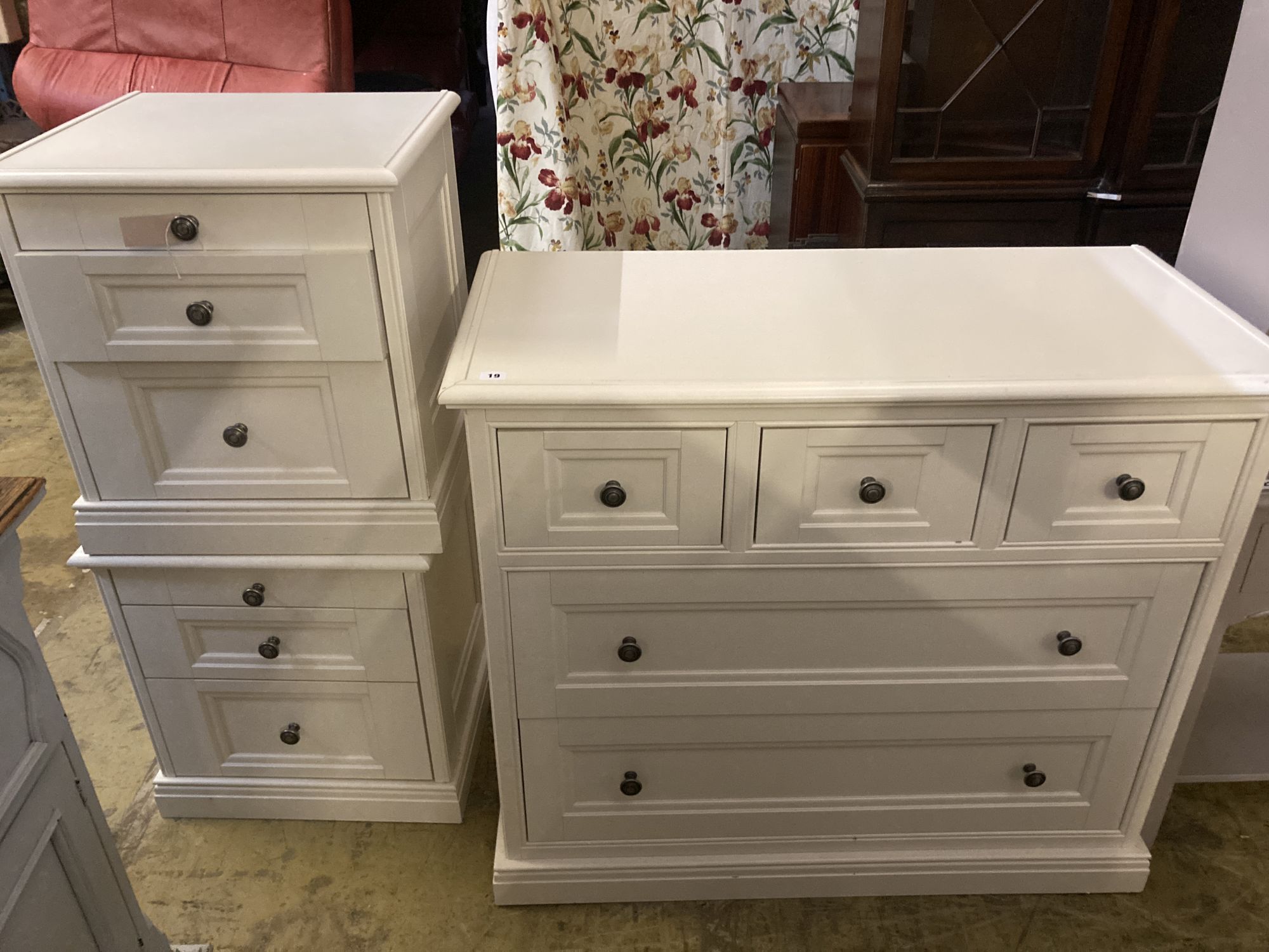 A contemporary white five drawer chest, together with a pair of matching three drawer bedside chests, larger width 105cm depth 50cm hei